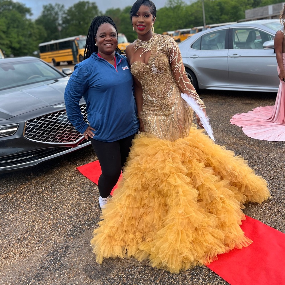 Gold prom dress worn only for a couple hours